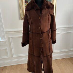 Full length suede coat. Brown color. 
This jacket is extremely warm.